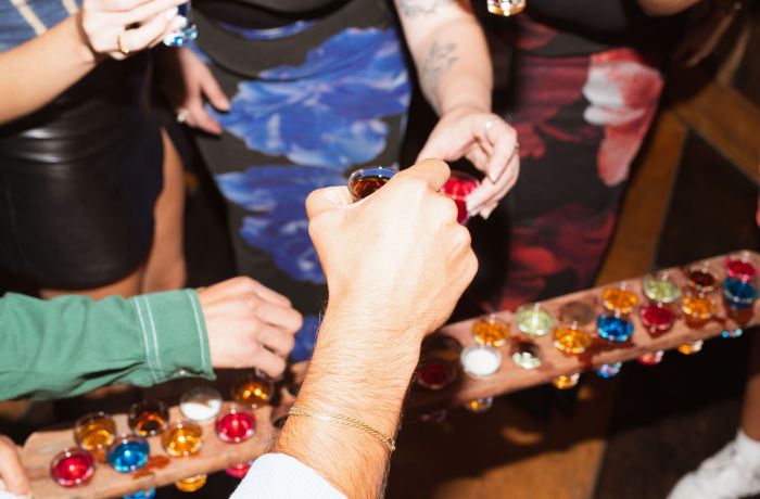people enjoying shots at revolution bars