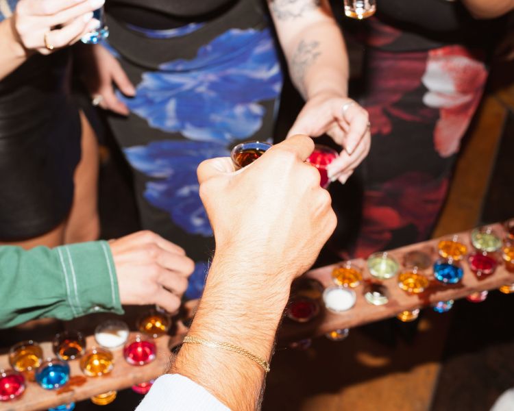 people enjoying shots at revolution bars