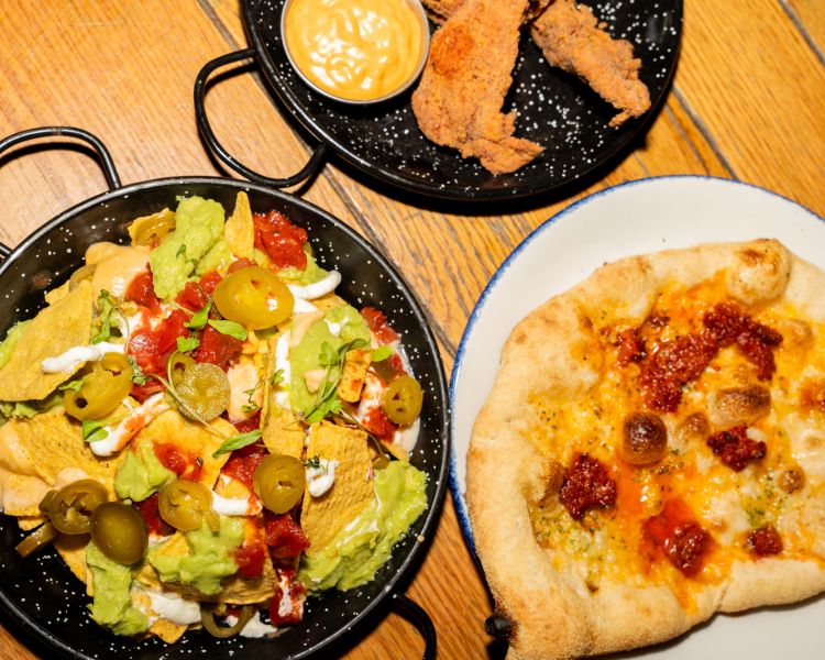 loaded nachos and pizza at revolution bars