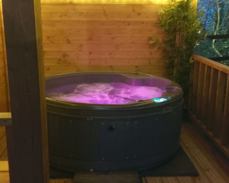 Bears house hot tub lit up at night