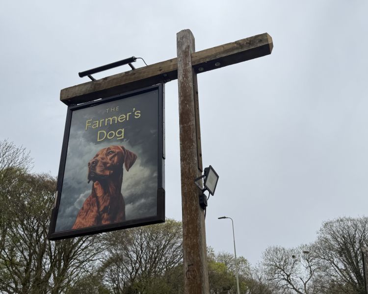 the farmers dog pub sign seen on clarkson's farm tour