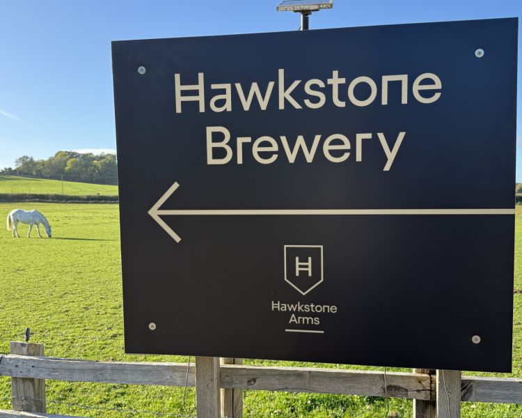 a sign for hawkstone brewery seen on clarkson's farm tour