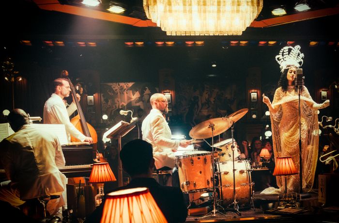 the stage with band and singer at the 58th Street immersive experience in london