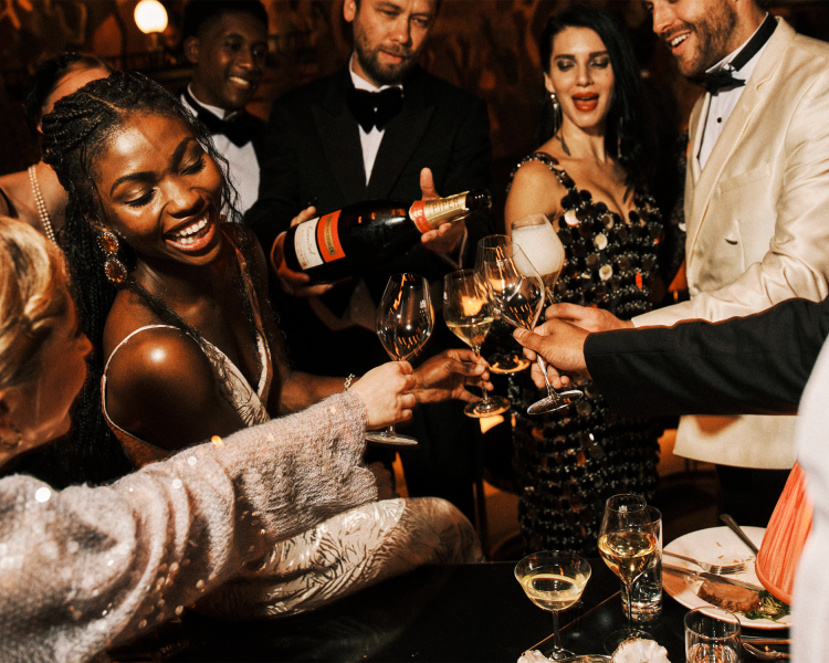 group of spectators drinking champagne at the 58th Street immersive experience in london