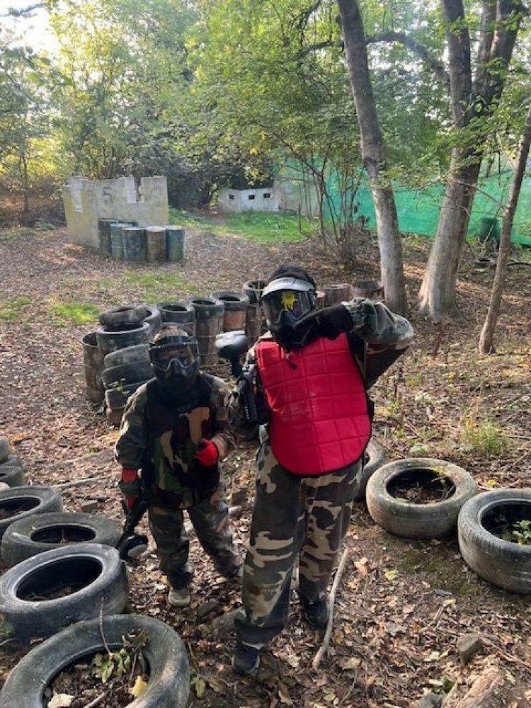 Two people in paintball gear