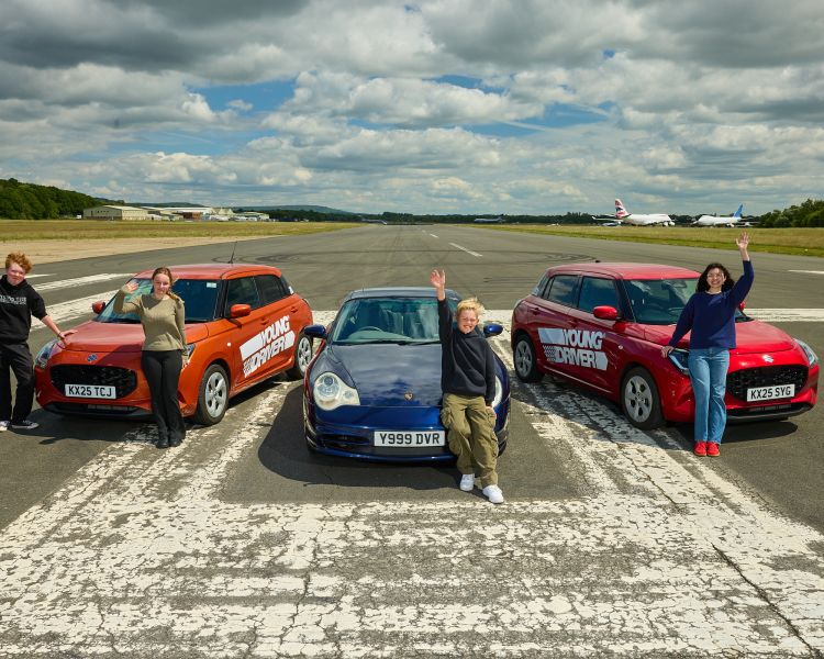 A group of young drivers in front of 3 cars