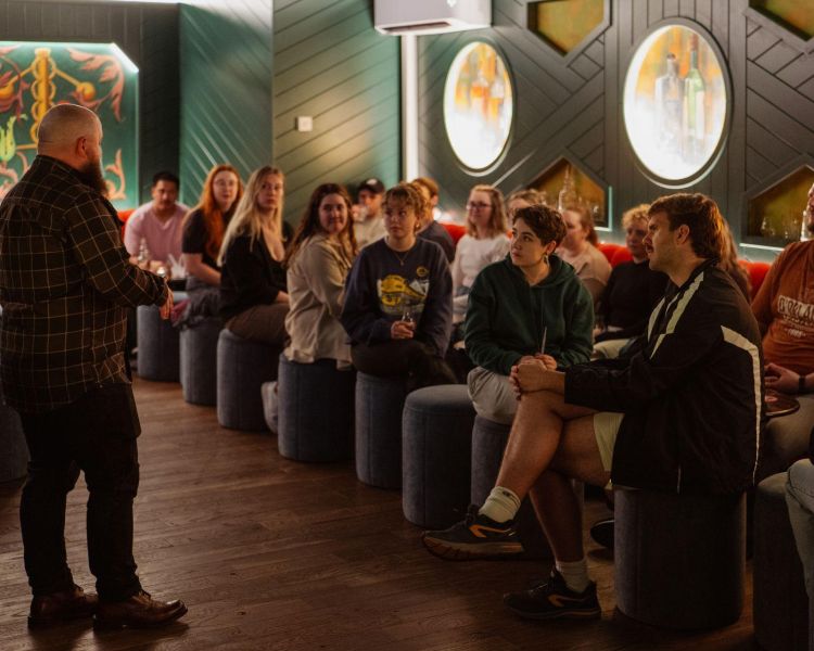 an expert guide hosting a whisky tasting experience in edinburgh