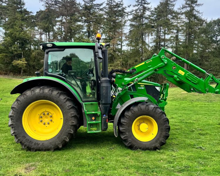side view of a green tractor seen on a tractor driving experience