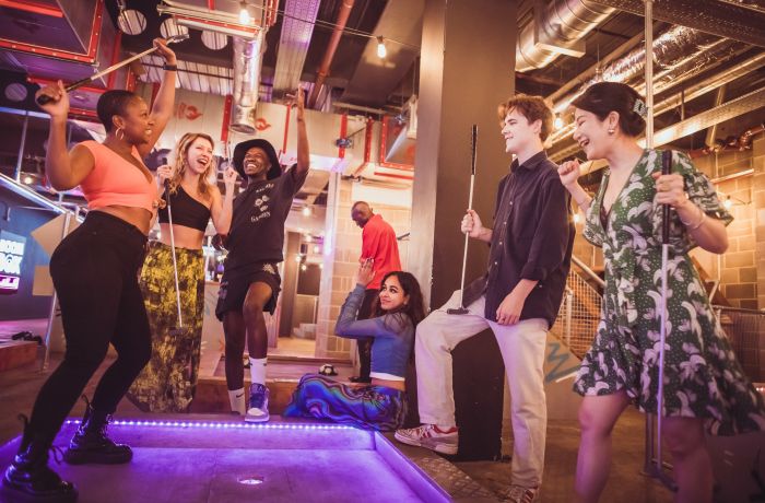group playing crazy golf at a boom battle bar