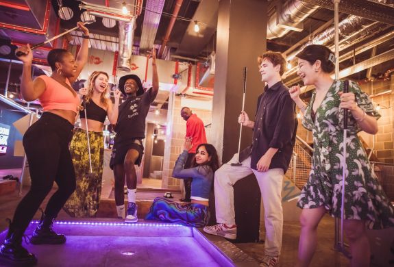 group playing crazy golf at a boom battle bar