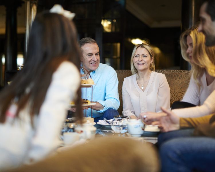 family enjoying afternoon tea at slayley hall hotel in hexham
