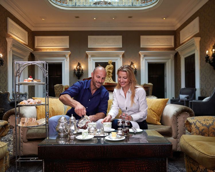 couple having afternoon tea at oulton hall hotel in yorkshire