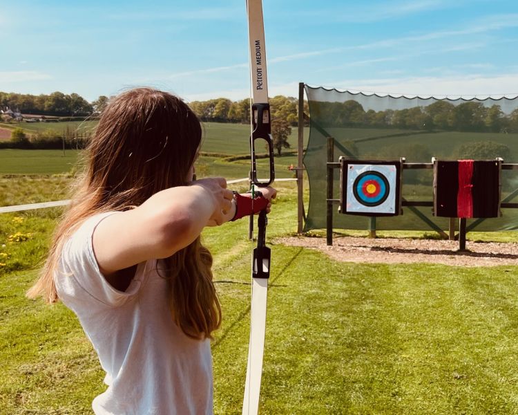 Girl on archery experience