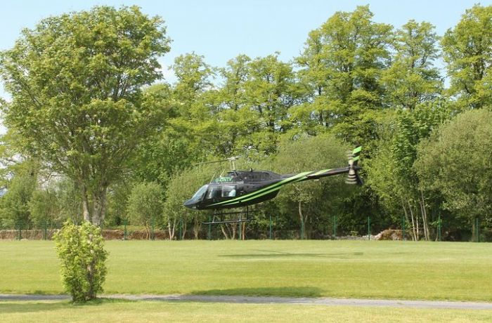 a black helicopter taking off for a nottingham helicopter ride