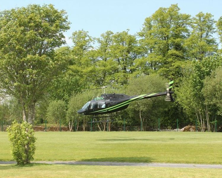 a black helicopter taking off for a nottingham helicopter ride