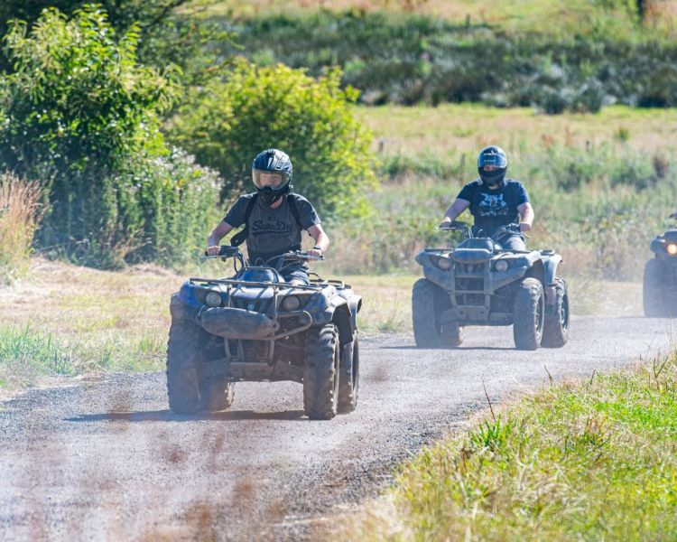 people riding quad bikes on dirt track in devon