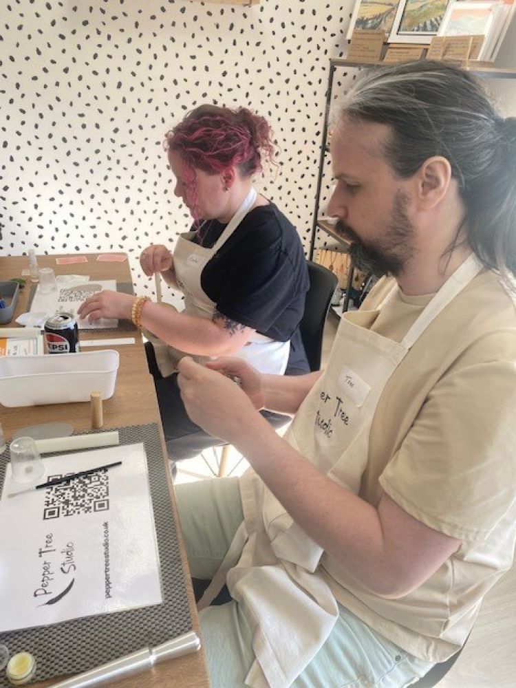 Man and woman at silver clay jewellery workshop