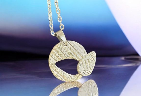 Cut out necklace made from silver clay