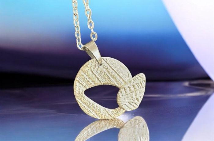 Cut out necklace made from silver clay