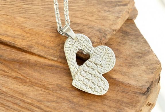 Heartshaped necklace made from silver clay