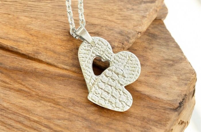 Heartshaped necklace made from silver clay