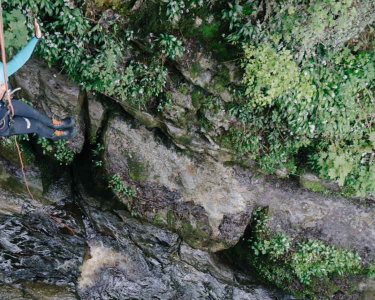 Lady abseiling at how stean gorge