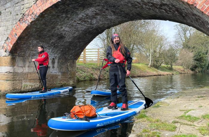 Instructor smiling while sup boarding