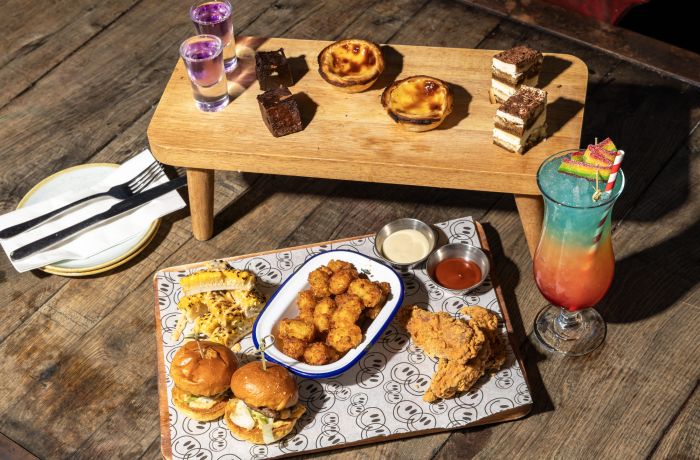 afternoon tea spread with a cocktail at revolution bars