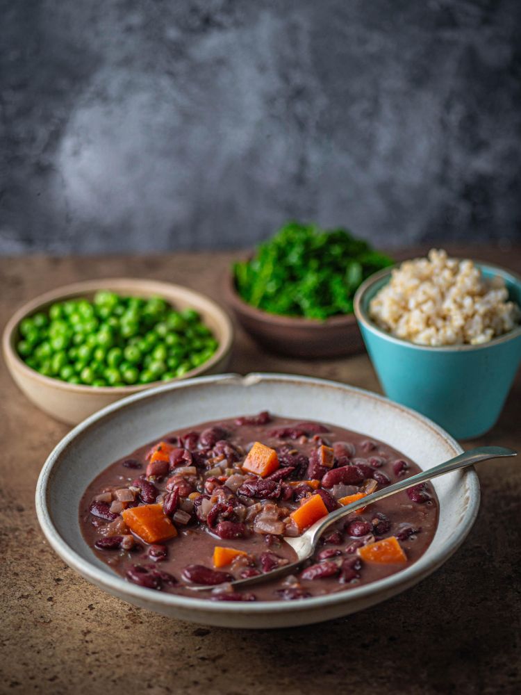 healthy meal with bowls of cooked vegetables on a table