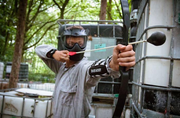 Man pulling arrow on combat archery experience