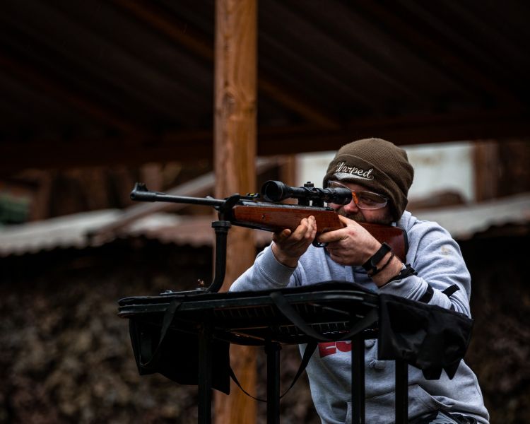 man on air rifle shooting experience