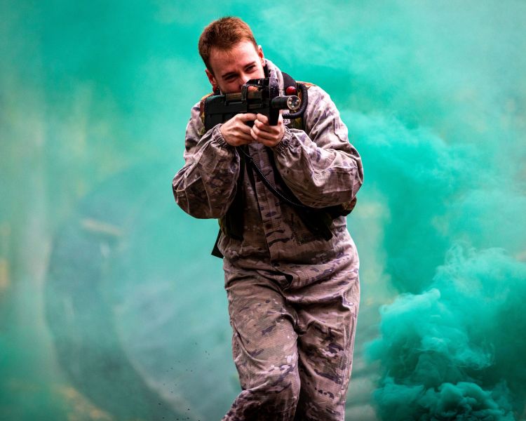 man on outdoor laser combat experience in woodland