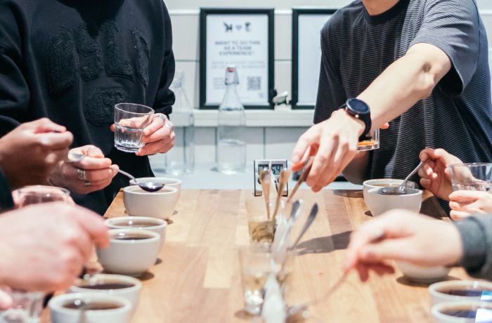 people around table on coffee tasting workshop in london