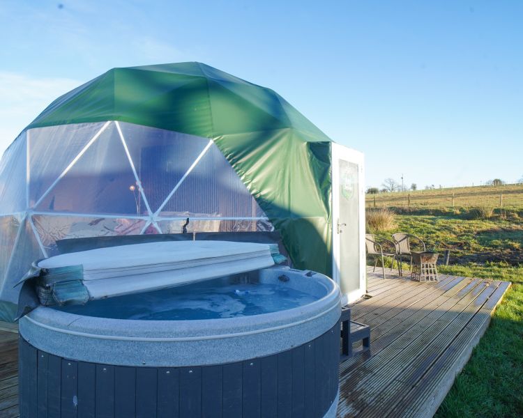Geodome exterior and hot tub
