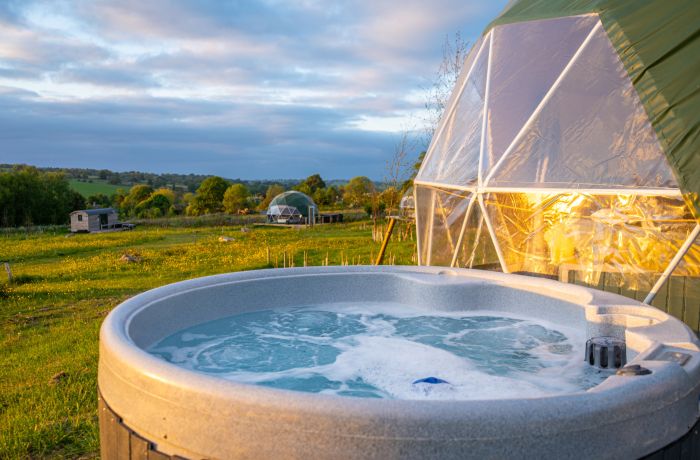 Geodome hot tub at sunset