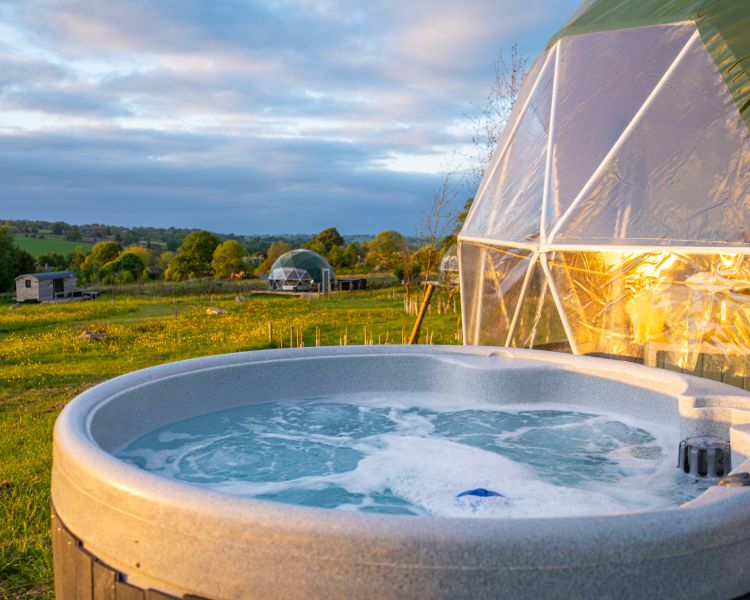 Geodome hot tub at sunset