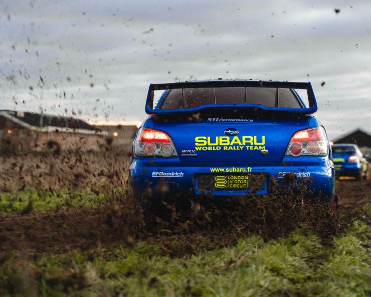 rally driving challenge on dirt track at family driving day