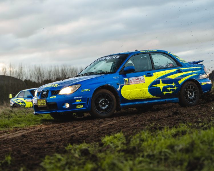 two subaru impreza's on a dirt track for a rally driving experience day