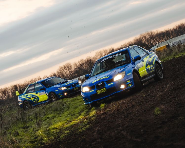 two subaru impreza's on a dirt track for a rally driving experience day