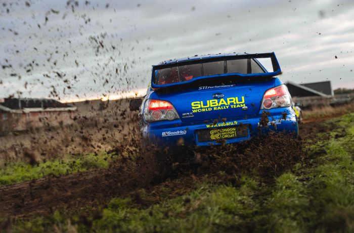 rear view of a subaru impreza on a dirt track for a rally driving experience day