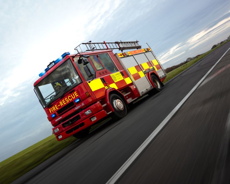 a dennis sabre fire engine on a track for a fire engine driving experience