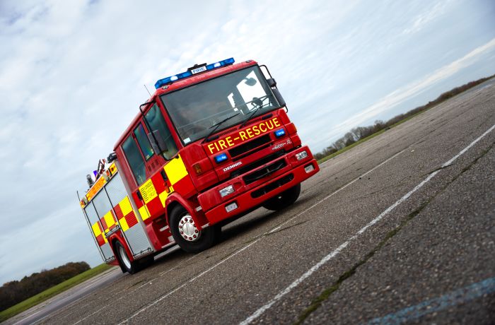 a dennis sabre fire engine on a track for a fire engine driving experience