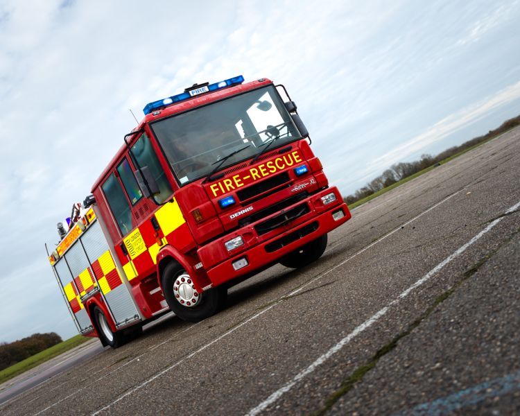 a dennis sabre fire engine on a track for a fire engine driving experience