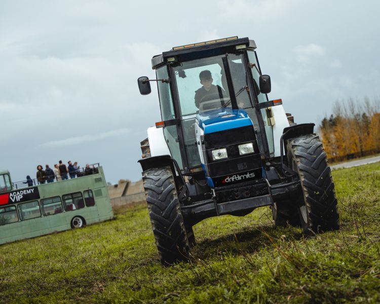 a lamborghini tractor being driven in a field on a tractor driving experience