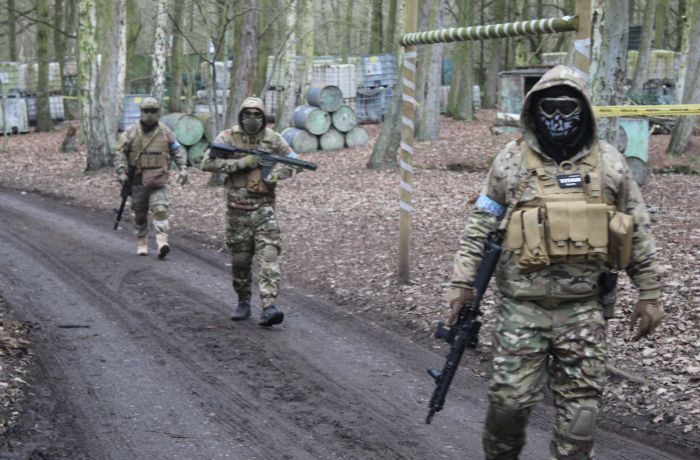 three men in combat gear on airsoft course near wolverhampton