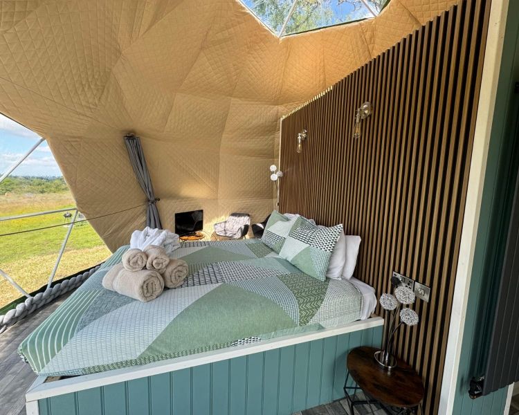 Windmill Retreats geodome window and bed interior view