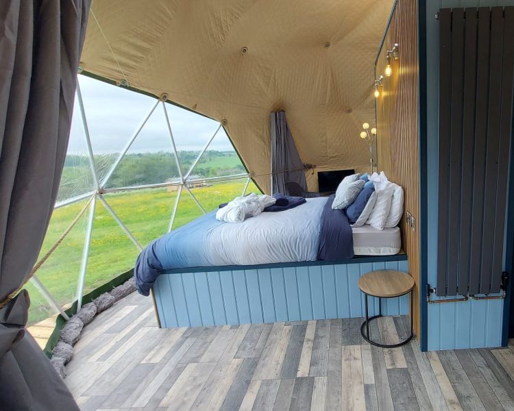 Windmill retreats interior with bed and window
