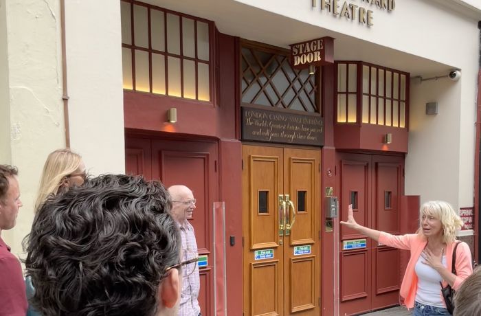 tour group outside the prince edward theatre in london