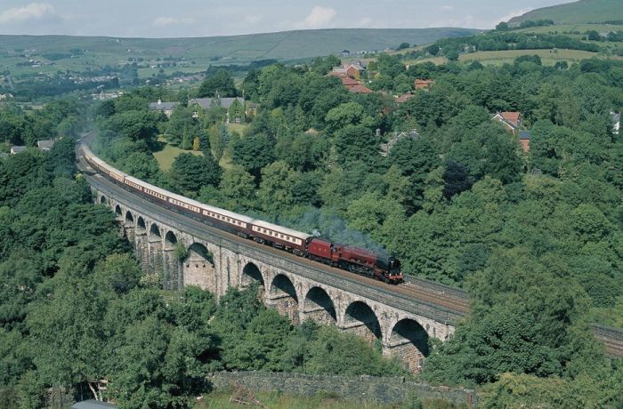 northern belle steam train travelling over a viaduct