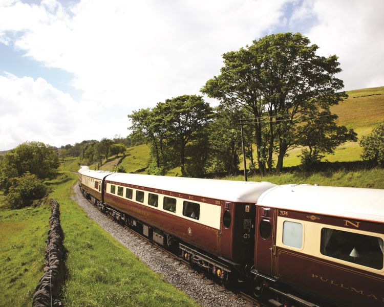 northern belle train travelling through countryside